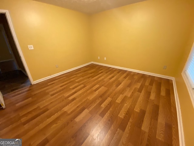 1472 Queenie Smith Rd NE, Conyers, GA 30012 - empty room featuring baseboards and wood finished floors