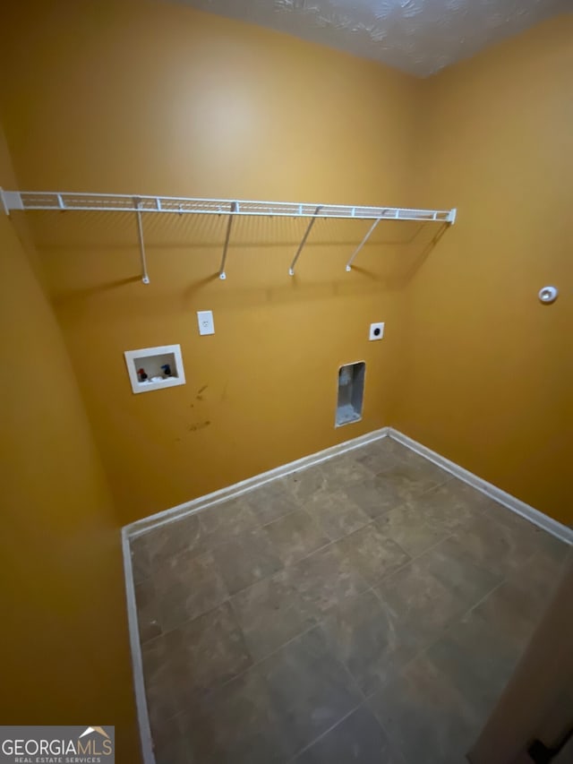 1472 Queenie Smith Rd NE, Conyers, GA 30012 - laundry room featuring hookup for a washing machine and electric dryer hookup
