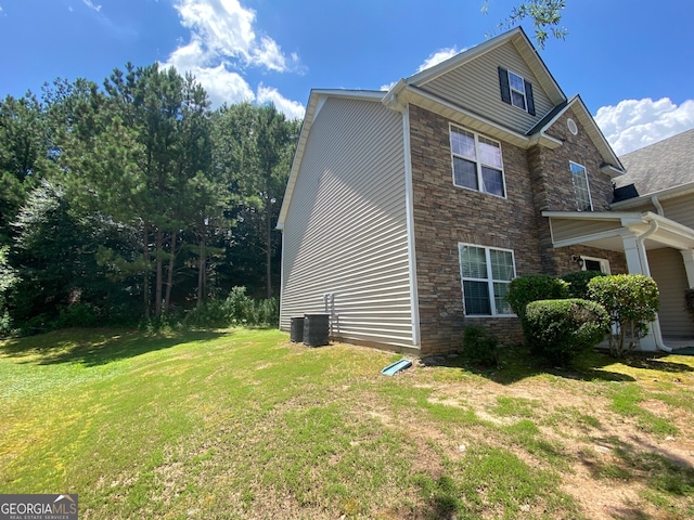 1472 Queenie Smith Rd NE, Conyers, GA 30012 - view of side of property featuring stone siding and a yard