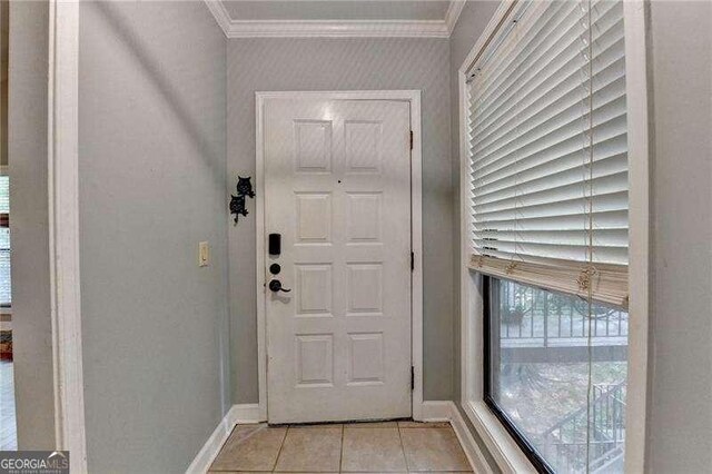 1010 Donegal SE, Smyrna, GA 30080 - entryway featuring crown molding and light tile patterned floors