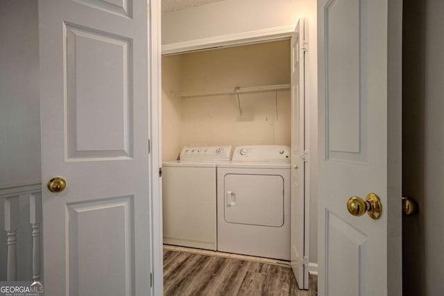 217 Bridgewater Trl, Canton, GA 30115 - washroom with washing machine and clothes dryer and wood finished floors