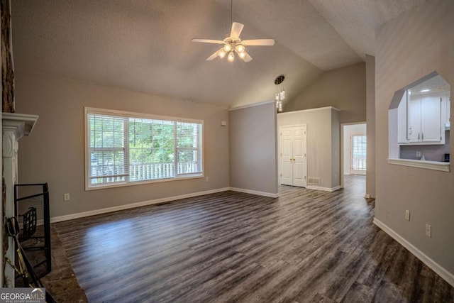 217 Bridgewater Trl, Canton, GA 30115 - unfurnished living room with plenty of natural light, a ceiling fan, dark wood-style floors, a textured ceiling, and lofted ceiling