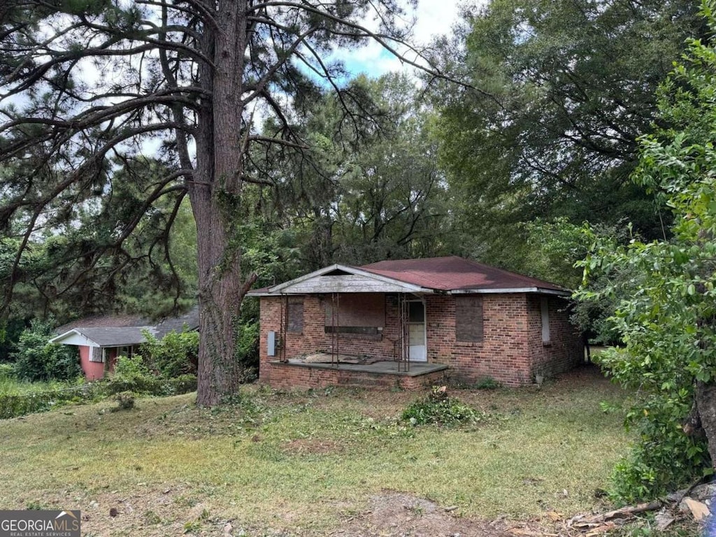 2119 Dove St, Macon, GA 31204 - view of front facade with brick siding and a porch