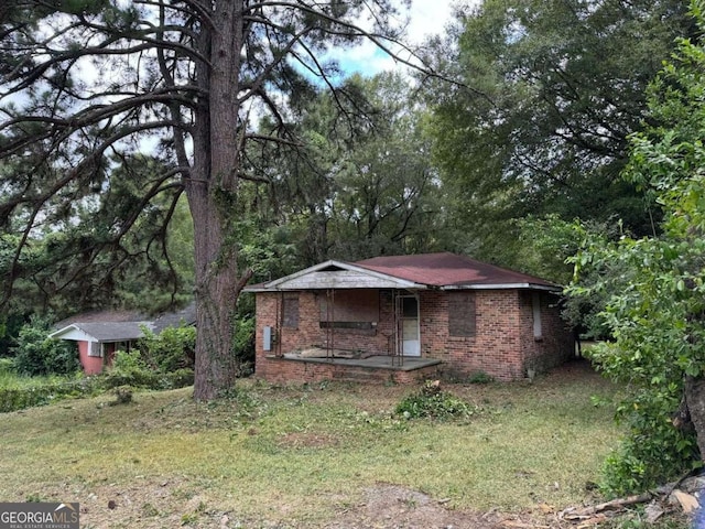 2119 Dove St, Macon, GA 31204 - view of front facade with brick siding and a porch