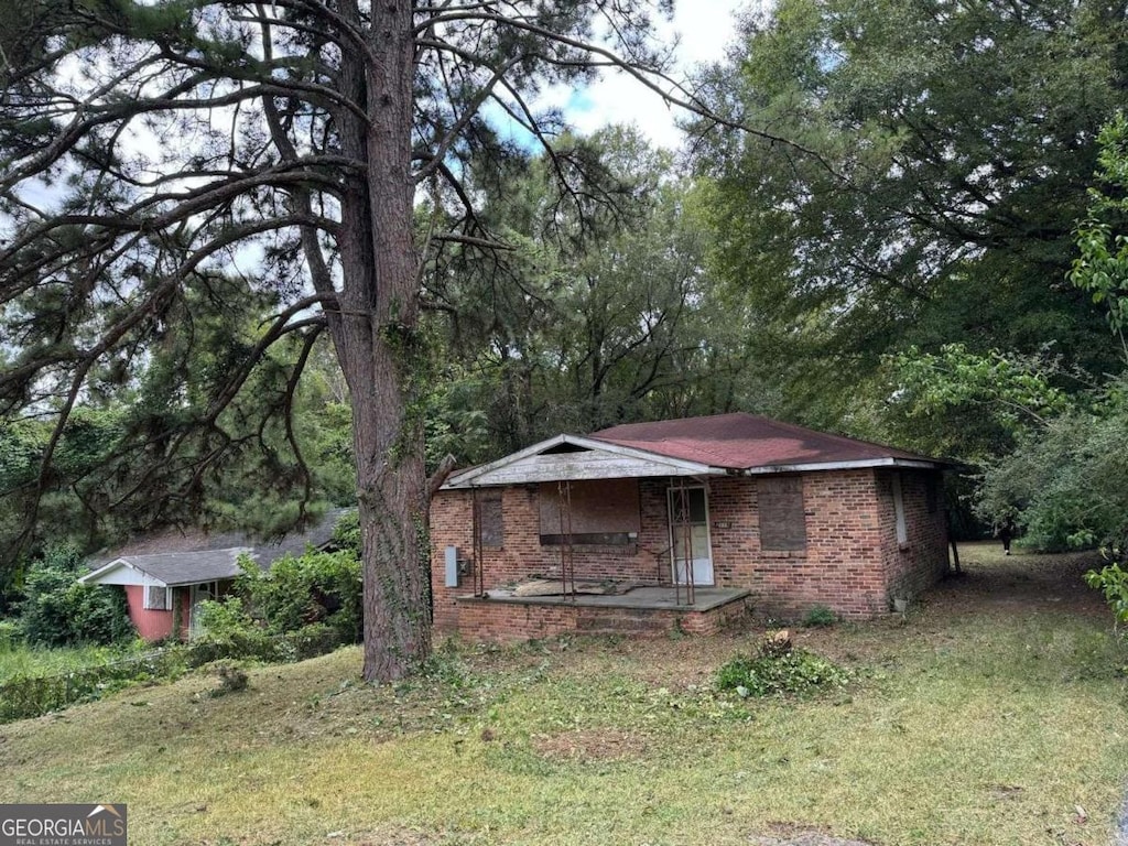 2119 Dove St, Macon, GA 31204 - view of front of property featuring brick siding and a porch