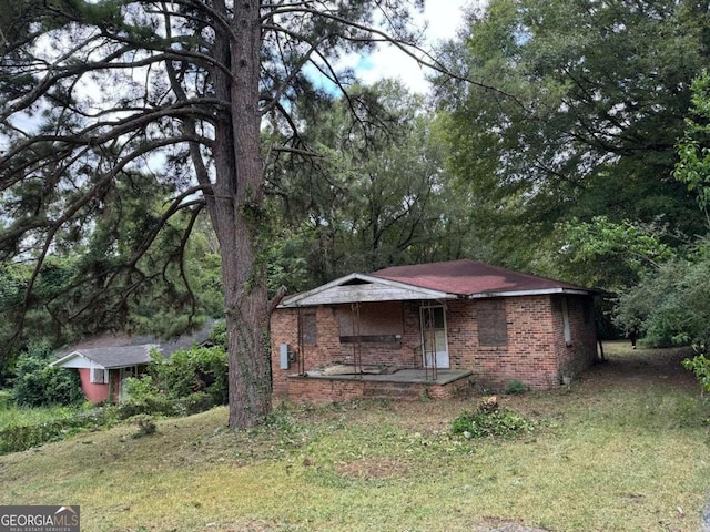 2119 Dove St, Macon, GA 31204 - view of front of property featuring brick siding and a porch