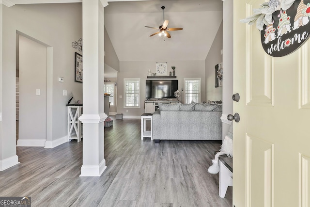 120 Mylee Cv, Barnesville, GA 30204 - living area with ornate columns, high vaulted ceiling, ceiling fan, and wood finished floors