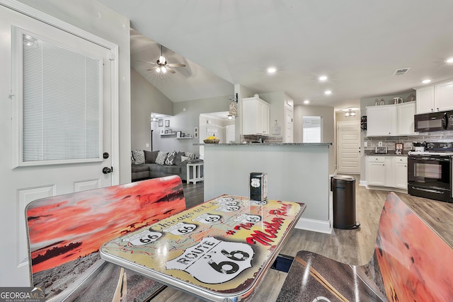 120 Mylee Cv, Barnesville, GA 30204 - dining room with light wood finished floors, ceiling fan, recessed lighting, and vaulted ceiling