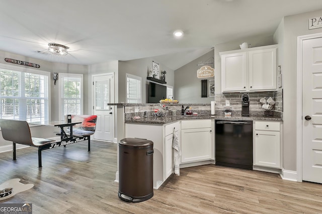 120 Mylee Cv, Barnesville, GA 30204 - kitchen with black dishwasher, a peninsula, decorative backsplash, white cabinetry, and light wood-type flooring