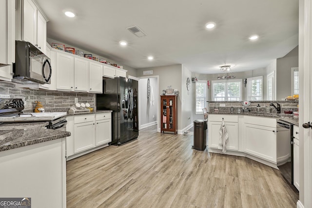 120 Mylee Cv, Barnesville, GA 30204 - kitchen with black appliances, tasteful backsplash, white cabinetry, light wood-style flooring, and recessed lighting