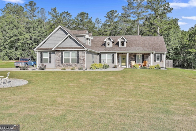 120 Mylee Cv, Barnesville, GA 30204 - view of front of home featuring a porch, a front yard, stone siding, and roof with shingles