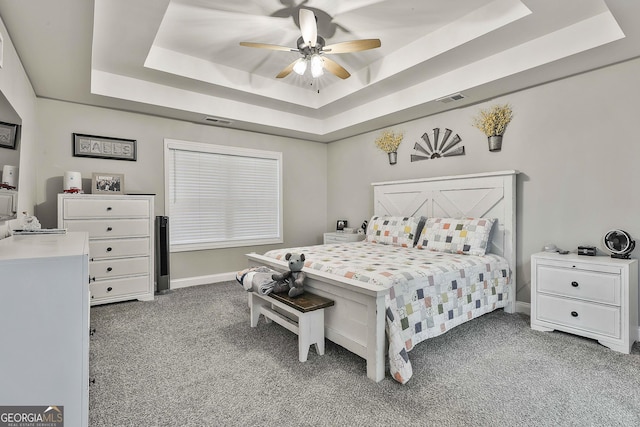 120 Mylee Cv, Barnesville, GA 30204 - carpeted bedroom with a raised ceiling and ceiling fan
