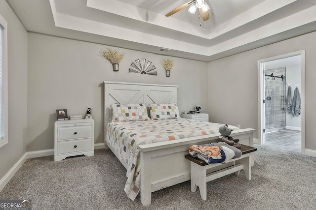 120 Mylee Cv, Barnesville, GA 30204 - bedroom featuring a raised ceiling, carpet, and ensuite bath