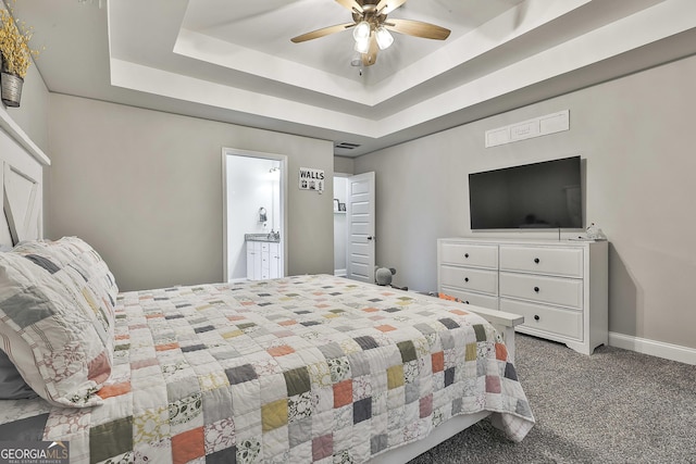 120 Mylee Cv, Barnesville, GA 30204 - carpeted bedroom featuring a tray ceiling and ceiling fan