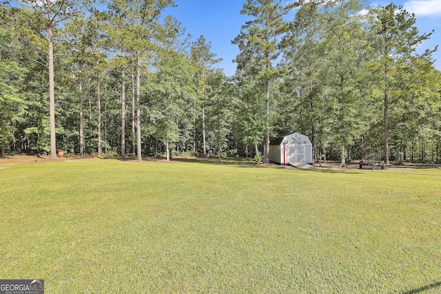 120 Mylee Cv, Barnesville, GA 30204 - view of grassy yard with a storage unit