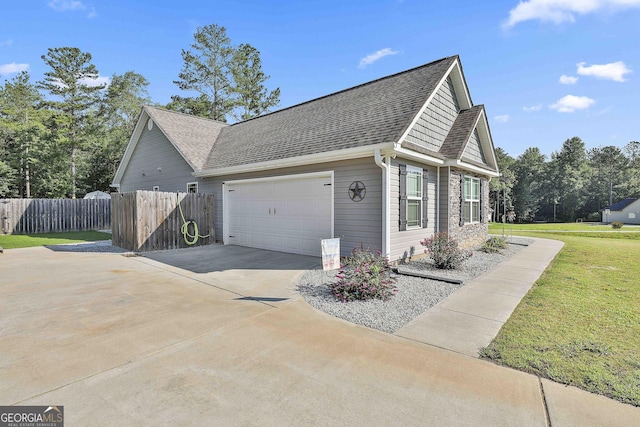 120 Mylee Cv, Barnesville, GA 30204 - view of home's exterior featuring driveway, a garage, and a shingled roof