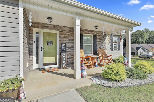 120 Mylee Cv, Barnesville, GA 30204 - property entrance featuring covered porch and stone siding