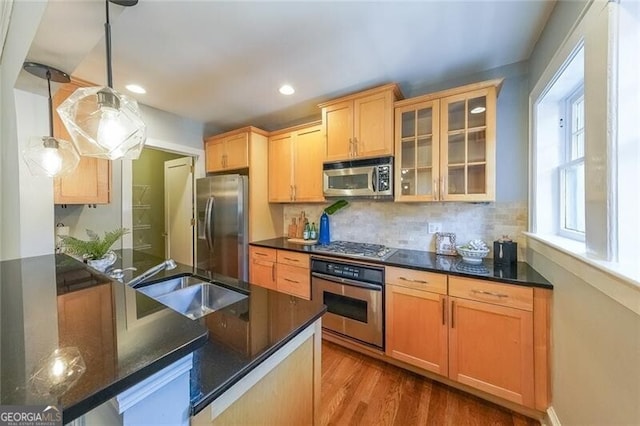 2 Collier Rd NW Unit 5, Atlanta, GA 30309 - kitchen with appliances with stainless steel finishes, glass insert cabinets, tasteful backsplash, dark wood-style floors, and recessed lighting