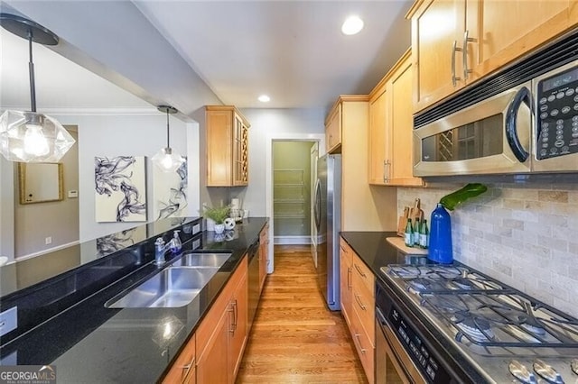 2 Collier Rd NW Unit 5, Atlanta, GA 30309 - kitchen with stainless steel appliances, light wood-style floors, tasteful backsplash, pendant lighting, and glass insert cabinets