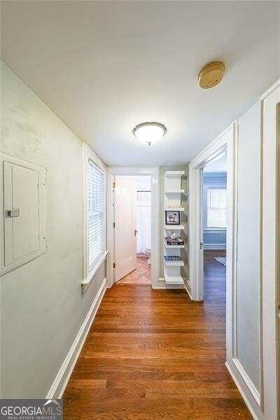 2 Collier Rd NW Unit 5, Atlanta, GA 30309 - hallway featuring electric panel and dark wood-style floors