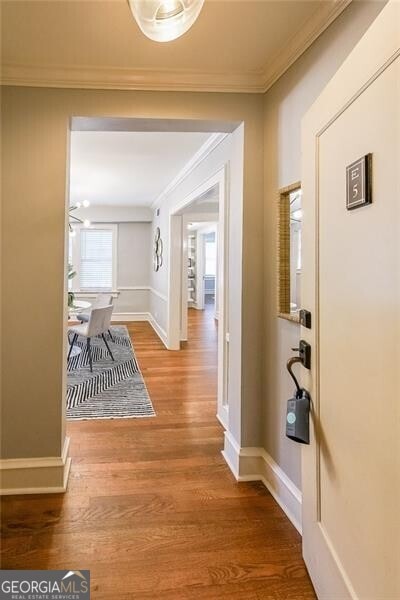 2 Collier Rd NW Unit 5, Atlanta, GA 30309 - hallway featuring ornamental molding and wood finished floors