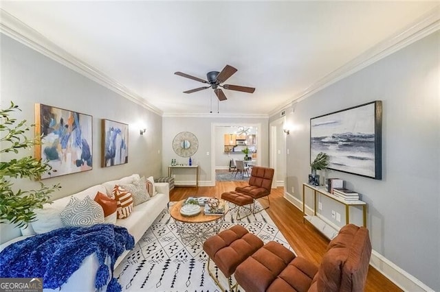 2 Collier Rd NW Unit 5, Atlanta, GA 30309 - living room featuring wood finished floors, a ceiling fan, and ornamental molding