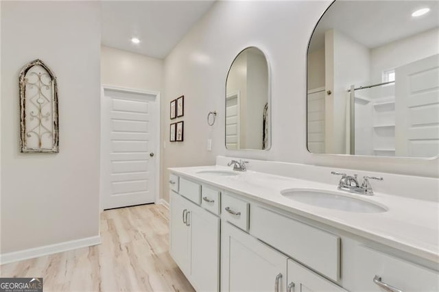 286 Kimberleys Xing, Jasper, GA 30143 - full bath featuring double vanity, wood finished floors, and recessed lighting