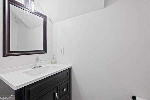 383 Ralph Mcgill Blvd NE Unit J, Atlanta, GA 30312 - bathroom with vanity and lofted ceiling
