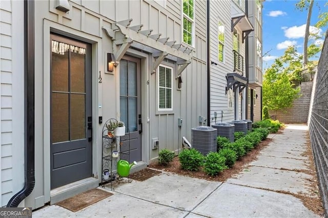 12 Becker Pl NW, Atlanta, GA 30307 - property entrance featuring board and batten siding and a patio area