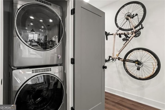 12 Becker Pl NW, Atlanta, GA 30307 - laundry area with stacked washer / dryer and dark wood finished floors