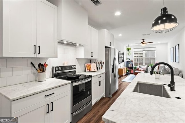 12 Becker Pl NW, Atlanta, GA 30307 - kitchen with stainless steel appliances, open floor plan, dark wood-type flooring, ceiling fan, and pendant lighting