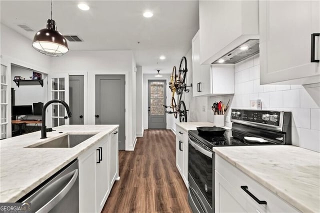 12 Becker Pl NW, Atlanta, GA 30307 - kitchen featuring appliances with stainless steel finishes, tasteful backsplash, dark wood-style floors, white cabinets, and recessed lighting