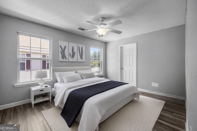 7 Springwater Dr, Port Wentworth, GA 31407 - bedroom with a textured ceiling, wood finished floors, and a ceiling fan
