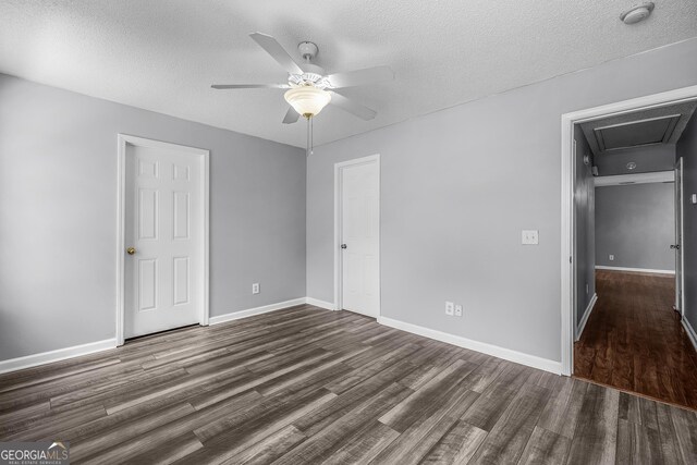 7 Springwater Dr, Port Wentworth, GA 31407 - unfurnished bedroom with dark wood finished floors, a textured ceiling, ceiling fan, and attic access