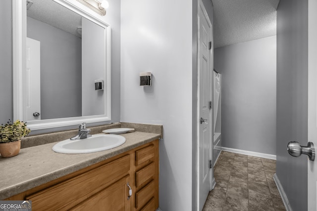 7 Springwater Dr, Port Wentworth, GA 31407 - bathroom with a textured ceiling, vanity, and shower / bath combo with shower curtain