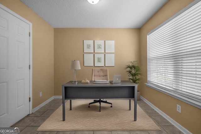 7 Springwater Dr, Port Wentworth, GA 31407 - home office featuring plenty of natural light, tile patterned flooring, and a textured ceiling