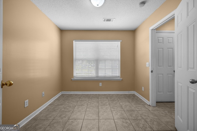 7 Springwater Dr, Port Wentworth, GA 31407 - spare room with a smoke detector, a textured ceiling, and light tile patterned floors