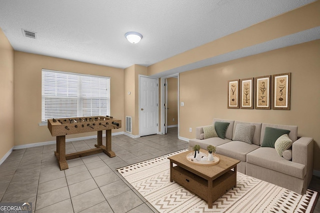 7 Springwater Dr, Port Wentworth, GA 31407 - living area featuring light tile patterned flooring and a textured ceiling