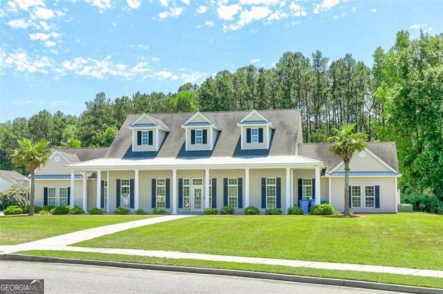 7 Springwater Dr, Port Wentworth, GA 31407 - view of front of house with french doors, a front lawn, and a porch
