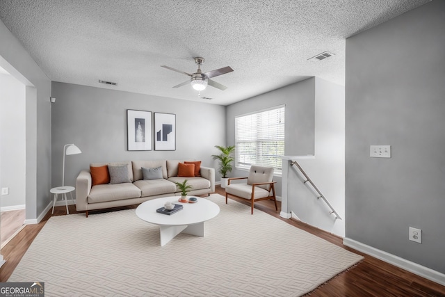 7 Springwater Dr, Port Wentworth, GA 31407 - living area with wood finished floors, a ceiling fan, and a textured ceiling