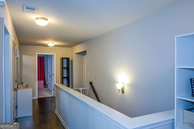325 Paces Dr, Lithia Springs, GA 30122 - corridor featuring an upstairs landing and dark wood-style flooring