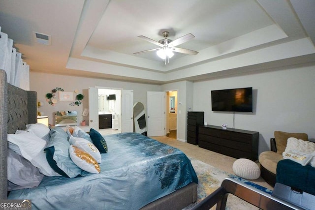 325 Paces Dr, Lithia Springs, GA 30122 - carpeted bedroom with a raised ceiling and connected bathroom