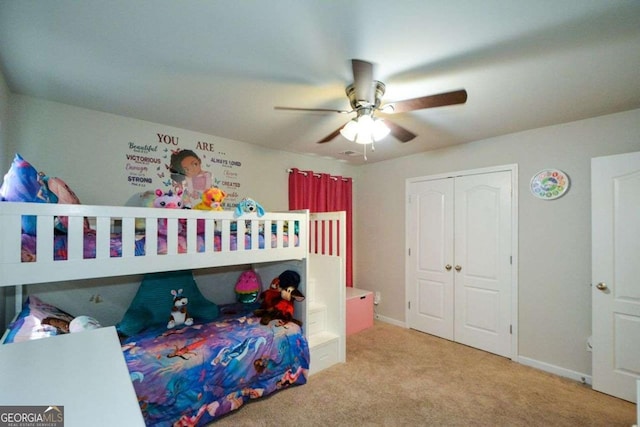 325 Paces Dr, Lithia Springs, GA 30122 - carpeted bedroom with a closet and a ceiling fan