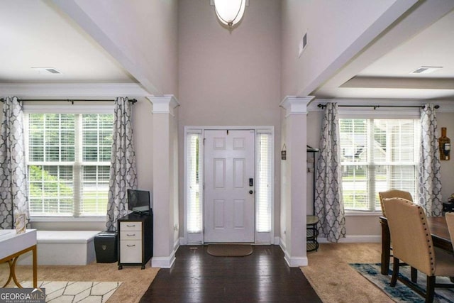 325 Paces Dr, Lithia Springs, GA 30122 - entrance foyer featuring decorative columns, healthy amount of natural light, and wood finished floors