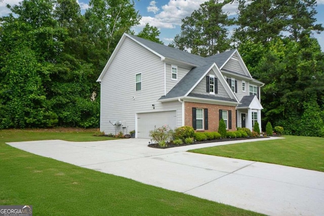 325 Paces Dr, Lithia Springs, GA 30122 - view of front of home with an attached garage, driveway, a front yard, and brick siding