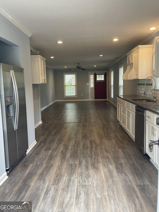 1833 Phillips Ave, East Point, GA 30344 - kitchen with stainless steel appliances, ornamental molding, a ceiling fan, recessed lighting, and white cabinetry