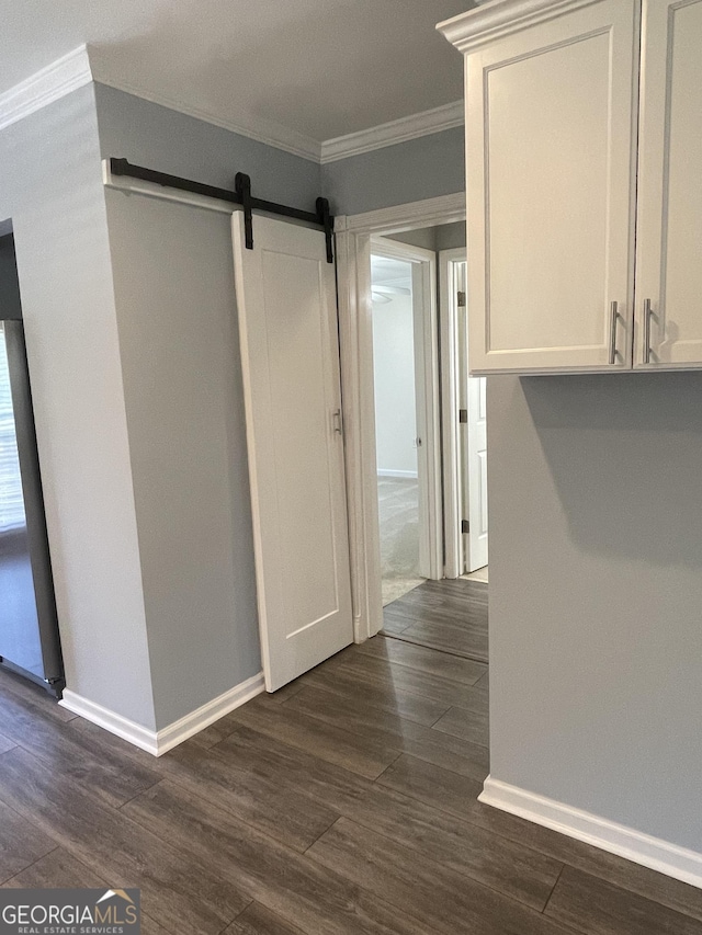 1833 Phillips Ave, East Point, GA 30344 - hall with crown molding, a barn door, and dark wood-style flooring