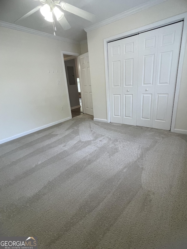 1833 Phillips Ave, East Point, GA 30344 - unfurnished bedroom with ornamental molding, a closet, carpet flooring, and a ceiling fan