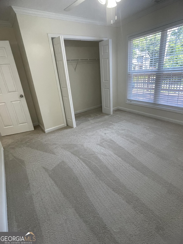 1833 Phillips Ave, East Point, GA 30344 - unfurnished bedroom with ornamental molding, carpet floors, a closet, and ceiling fan