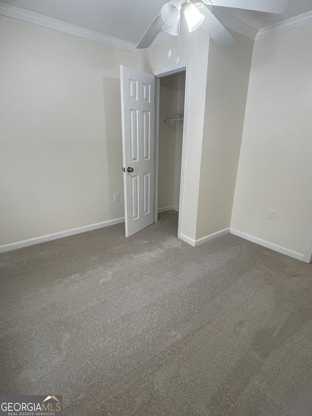 1833 Phillips Ave, East Point, GA 30344 - unfurnished bedroom with crown molding, carpet, ceiling fan, and a closet